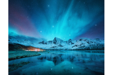 Northern lights, snowy mountains