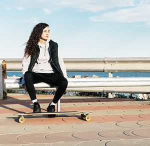 Teenage Girl Sitting on a Bench