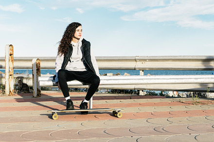 Teenage Girl Sitting on a Bench